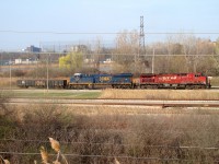 [Editors note: D718 is abolished and used CSX Canadian crew from Sarnia] D718 is seen here switching CN's Electric Yard after dropping off interchange cars for CN and The Essex Terminal Railway. This shot is taken from a berm that follows alongside the yard. The former CASO main is seen in the bushes near the bottom of the photo. 