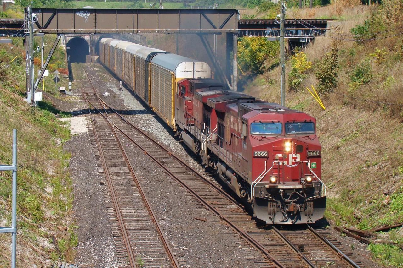 CP 146 blasts out of the Detroit River Tunnel with a solid set of autoracks.