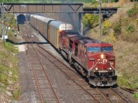 CP 146 blasts out of the Detroit River Tunnel with a solid set of autoracks.