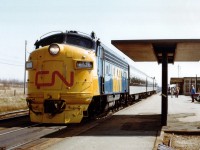 In the mid 1970s the passenger service in Canada was rather tattered. In order to improve service, CN offered up a new marketing slogan "VIA CN" complete with a fresh blue/yellow distinctive paint scheme. In January 1977 the government decided on a wholly owned subsidiary that would operate CN and CP passenger trains, which became effective in June as the new VIA RAIL Canada took over all the main passenger services in the country. March 31, 1978 VIA took over all CN pass. equipment, next day VIA became a Crown Corporation and in Sept of 1978 took over all CP passenger equipment. This image of mid-April 1977 of a westbound at Cornwall was my first sighting of the new paint scheme, and one of the very few seen with the "full dress" paint on the nose. This leaves me wondering which unit was painted first, and when.
