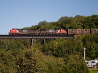 Bridging the gap! The southbound freight roars over the always impressive Bellevue Valley trestle, accompanied by a sea of lush green foliage. The sound of the GE's working hard echoed across the valley, truly a sight to behold.