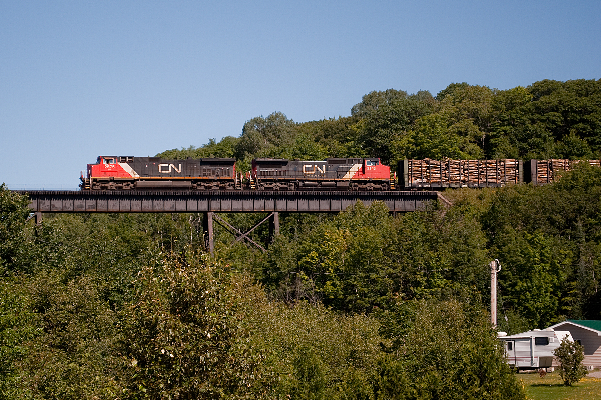 Bridging the gap! The southbound freight roars over the always impressive Bellevue Valley trestle, accompanied by a sea of lush green foliage. The sound of the GE's working hard echoed across the valley, truly a sight to behold.