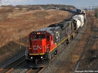 A rare catch these days, CN 2118 and IC 1026 lead a 369 with all the power on the head end (no DPU). This is somewhat worthy to note, as earlier they had a broken knuckle near Grafton in hogback country; a common occurrence before, and the reason many tonnage trains receive, DPU's on the Kingston Sub. I've seen examples of both the 2100 series C40-8's and the 1000 series SD70's in use as remotes with 2200/2300/8800/8900 leaders, but never together as a lead and remote pair. Perhaps they can't work together in DPU, but regardless, a nice sight in a world flooded with wide nosed locomotives. Thank you Delic. 1337hrs.