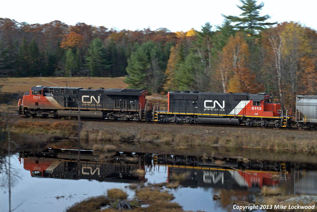CN 2259 and IC 6113 roll southbound with 114's train at Brignall. 1127hrs.