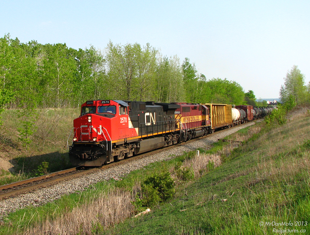 People make mistakes, one of which I learned early on is try to stay in the photo line - especially when something good is on the way. A few foamers present might remember seeing this train: CN 398 on the ascent to Georgetown, rumbling through Mile 30 with CN 2570 leading a rare visitor: 3025, a Wisconsin Central GP40. As the trailing unit passed by everybody turned, cameras clicked again, and all in attendance were happy.