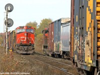 CN 451 pulls into the siding at Pine Orchard as 450 holds the main and gives a roll-by. That these are both CN's North Bay jobs and counterparts is fairly obvious by the presence of Ontario Northland cars on both. CN 2577 and NS 6627 head 450 while CN 8846 goes it alone on 451. 1407hrs.