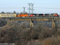 Eastbound CN train 332 soars above the Humber River behind CN 2589, 5479, and EJ&E 674. Its been many years since I last shot here (think EcoRail for an idea of a time line), and apparently an EJ&E unit is what it takes to lure me back. Thank you Cam. 1402hrs.