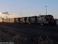 Dropping down the York Sub, CN 570 is about to enter the Kingston Sub at Liverpool Jct. with a quartet of GP9's. CN 4112 and 4110 power the train, while CP 1578 and CP 1548 are dead in tow, on their way to Oshawa to be stripped and scrapped. Sunset on a cold and very windy day seems a fitting way to catch these two rolling what is likely their last few miles. Thanks Bill for the disposition information of the two GP9u's. 1618hrs.