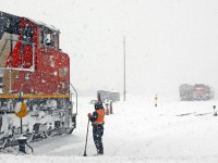 Thanks for the help! CN 509 pulls into the west end of Racecourse yard as CN 511's brakeman waves to the engineer. Things were running kind of slow, as many switches and derails had to be swept out. CN 509's crew reported that west of mile 14 on the Strathroy sub, there was no snow at all (people out there "need lawnmowers not snowblowers" the crew reported). To which, the reply was "Welcome to Santa's Wonderland!" With over 18" of snow on the ground, it kind of did look like the north pole a bit...