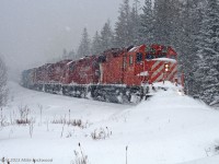 Hands down, the best chase I've ever done on the Havelock Sub, and I've done a few, was January 18, 2009. It had snowed much of the previous night on the moraine, and kept snowing, heavily at times, all the way from Toronto to Peterborough, where I finally ended the pursuit. Shot after shot after shot of them running through a winter wonderland, all the time pushing a wall of snow up to, and sometimes above, the top of the plow at least as far east as Cavan Station. So much snow that the ditchlight on the hogger's side has shorted out (it was working when they left Toronto Yard. Pictured is the train blowing for the Porter Road crossing south of Bethany, behind CP 3042, 8200, 3045, and 3105 with 30 cars on the headpin. 1217hrs.