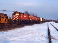 CP 507 highballs through Dorval past a Railgrinder, with a trio of MLWs.