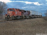 CP 6071 amd CEFX 100 lead 121's train through Lovekin on a typically gloomy autumn day. The 9100 series SD90's were not all that common on the eXpressway, and the CEFX SD90's much less so; this is the only one I recall seeing. 1636hrs.