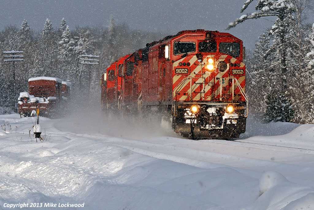 The sun has come out, however the snow has yet to taper off as a storm off Georgian Bay moves on, revealing a winter wonderland at CN's Waubamik siding. Utilizing directional running rights over CN's Bala Sub, CP 220 cruises south behind an SD40-2F and five SD40-2's, with about 11 miles separating it from home rails of CP's Parry Sound Sub at Boyne. Of the locomotives powering this train, CP 9002, 5763, 5984, 5925, 6037 and 5966, only two, 5763 and 6037, as of November 6, 2013 are still listed on the active roster. Sadly, the 9002 was retired less than two years after this shot was taken. 1451hrs.