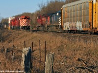 Crawling through the siding at Craighurst, CP 9004, 6248, and 6016 meet CP 8524 and CEFX 1058 heading up 113's train. 1556hrs.