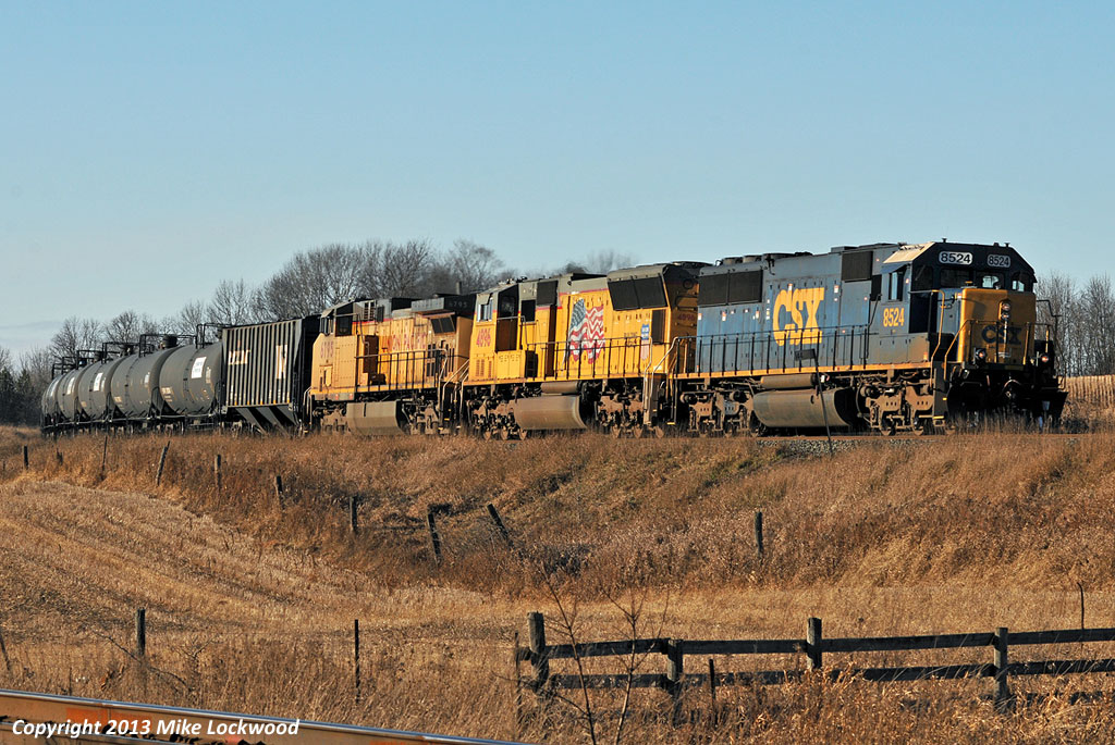 Passing mile 144 of Canadian Pacific's Belleville Sub, and about to hit the west switch of Port Hope siding where they'll meet CP 241, CSX 8524, UP 4896, and UP 6795 roll east with CP 642. 1439hrs.