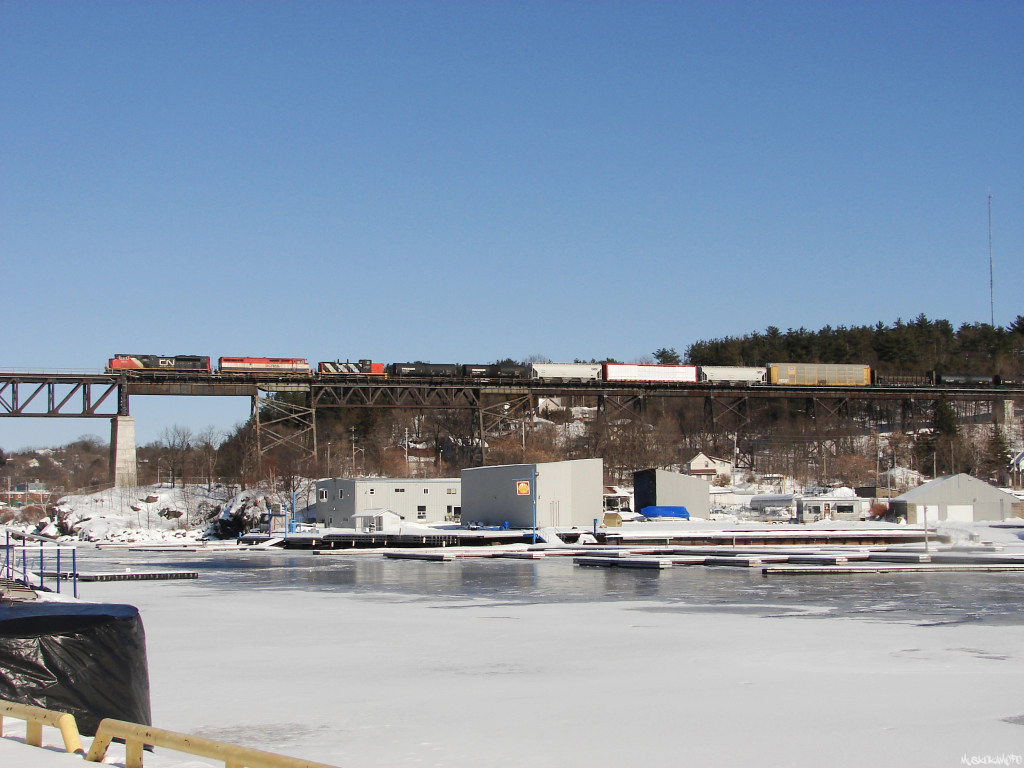 CN 8814 North crosses CP's Parry Sound trestle with a unique consist of CN 8814/BCOL 4610/CN 1407. CN 1407 has since been retired, and was seen in the deadline in Edmonton earlier this year by Colin Arnot: http://www.railpictures.ca/?attachment_id=9057
