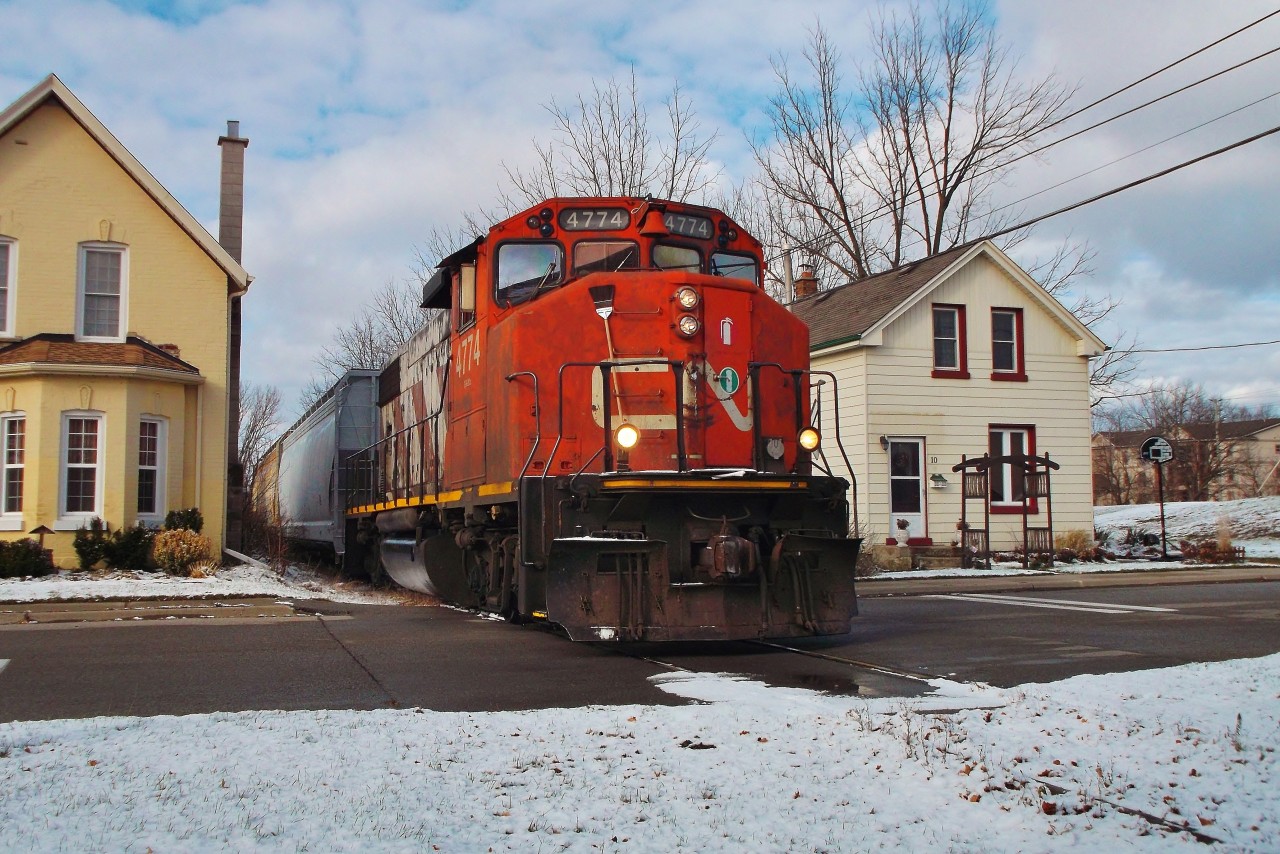 CN 4774 is in charge of this weeks local to Ingenia, seen here crossing Port Street just minutes away from his destination, the last customer on the old TH&B in Brantford.