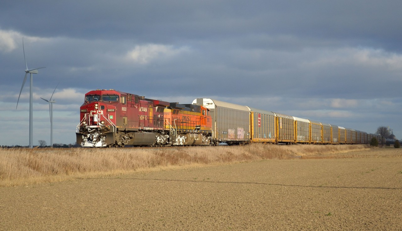 CP 609 led by CP 9833 & BNSF 5103 head westbound thru Haycroft with 21 autoracks and an empty crude oil train.