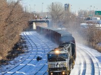 A pair of ex-Conrail SD60I's (NS 6721 & NS 6731) head west through Montreal West with a short train on a beautifully sunny but frigid winter morning. This train usually operates in daylight, so this was a nice catch for me. For more train photos, check out http://www.flickr.com/photos/mtlwestrailfan/ 