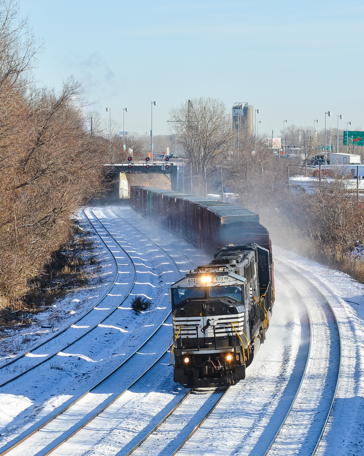 A pair of ex-Conrail SD60I's (NS 6721 & NS 6731) head west through Montreal West with a short train on a beautifully sunny but frigid winter morning. This train usually operates in daylight, so this was a nice catch for me. For more train photos, check out http://www.flickr.com/photos/mtlwestrailfan/