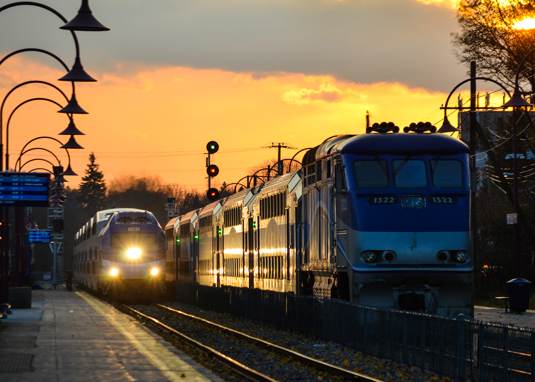 At left an AMT deadhead movement led by AMT 1363 heads east through Montreal West. At the right AMT 1322 is shoving AMT 19 westwards after making its station stop. The train on the left has Bombardier bilevel cars while the one on the right has newer Bombardier multilevel cars. For more train photos, check out http://www.flickr.com/photos/mtlwestrailfan/