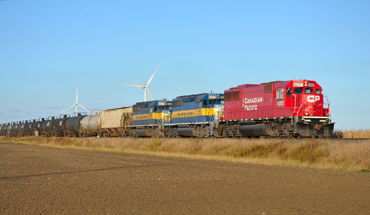 CP 642 heads eastbound thru Haycroft into the morning sun with a full load of ethanol.