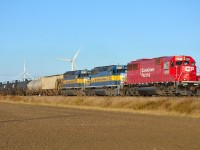 CP 642 heads eastbound thru Haycroft into the morning sun with a full load of ethanol.