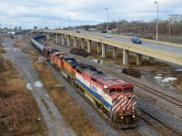 <b>BNSF power a long way from home....</b> BCOL 4623, BNSF 4011 & BNSF 9190 are the power on a loaded oil train (CN 710) that is heading east after a crew change at Turcot West. Up until recently BNSF power was practically unheard of in Quebec, but is getting more common with the increase in oil trains. CN 710 originated in North Dakota and is bound for the Valero refinery in St-Romuald, Quebec (near Quebec City). For more train photos, check out http://www.flickr.com/photos/mtlwestrailfan/ 