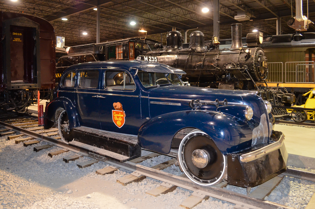 This track inspection car was originally built for Dr. H.A. Beatty (brother of CP president Sir Edward Wentworth Beatty) as a regular 1939 Buick Century. In 1947 he donated it to CP, which converted it to the vehicle seen here. According to the information on the placard at Exporail "the original chassis was replaced by a customized frame that includes an autonomous turntable, two railway axles, and flanged wheels.....The original spring suspension was replaced by an elliptic spring system, and an air brake system and a compressor were added to the vehicle." Behind is CP 144, a 4-4-0. For more train photos, check out http://www.flickr.com/photos/mtlwestrailfan/