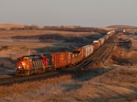 In the very last rays of daylight, 5515 and IC 6113 lead 301 past the siding at Neola. 