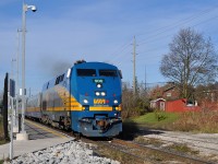 VIA 84 passes the new Acton GO station on its way to Toronto, with 4 LRC coaches and VIA 6438 bringing up the rear. Acton isn't a VIA stop; CN discontinued passenger service here in 1967.