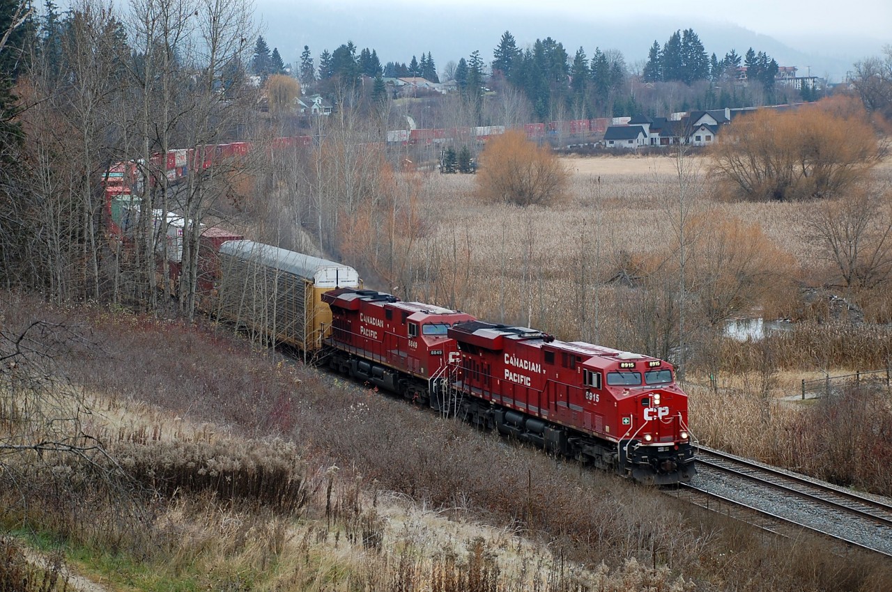 A pair of ES44AC's add a bit of colour to a foggy day in Salmon Arm as they head out of town with an eastbound Intermodal.