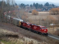 A pair of ES44AC's add a bit of colour to a foggy day in Salmon Arm as they head out of town with an eastbound Intermodal.