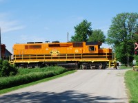 GEXR 581 is almost home as it heads southbound through Sebringville with the new kid in town leading, QGRY 2303... still the only unit in G&W corporate orange/black on the Goderich-Exeter.