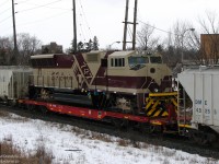 A good source of intel is always a treat, and makes catching the goodies so much easier. Try as I might, whenever they shipped these particular export locos out from the factory for forwarding to the port it was either cloudy or snowy, and sometimes both.  <br><br> But trailing on GEXR #432 this cloudy day was one of them: E.F. Carajas 747, an EMD SD70M, heading to its new owner in Brazil. Due to the different gauge track in Brazil, it was necessary to mount the locomotive on a heavy-duty flatcar (8-axle KRL 70986 in this shot) instead of moving it on its own wheels over North American trackage. <br><br> According to sources, these units were part of an order numbered 728-755, built by EMD in London, Ontario Canada for mining company Companhia Vale do Rio Doce in Brazil (CVRD, the company, is now part of giant VALE) to operate on their railroad Estrada de Ferro Carajás ("E.F.Carajas"). The photographer shot the first 6 units of the order in transit December 13th 2006, and missed the last unit as it went under his GO bus on Airport Road, March 27th 2007.