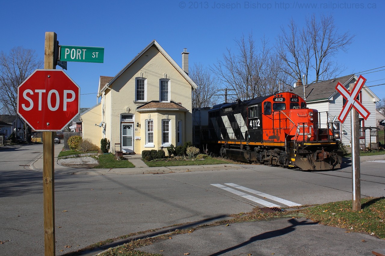 CN 580 trundles down the Burford Spur past the houses on Port Street.
