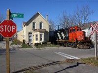 CN 580 trundles down the Burford Spur past the houses on Port Street. 