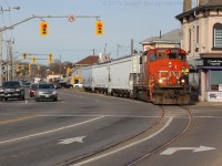 CN 4774 begins to slowly cross Colbourne Street in downtown Brantford.  They have set the traffic lights to stop traffic on Clarence Street so that they can cross over Clarence safely.  On Tuesday 435 dropped 4774 off in the yard in Brantford and hopefully it sticks around for a while.