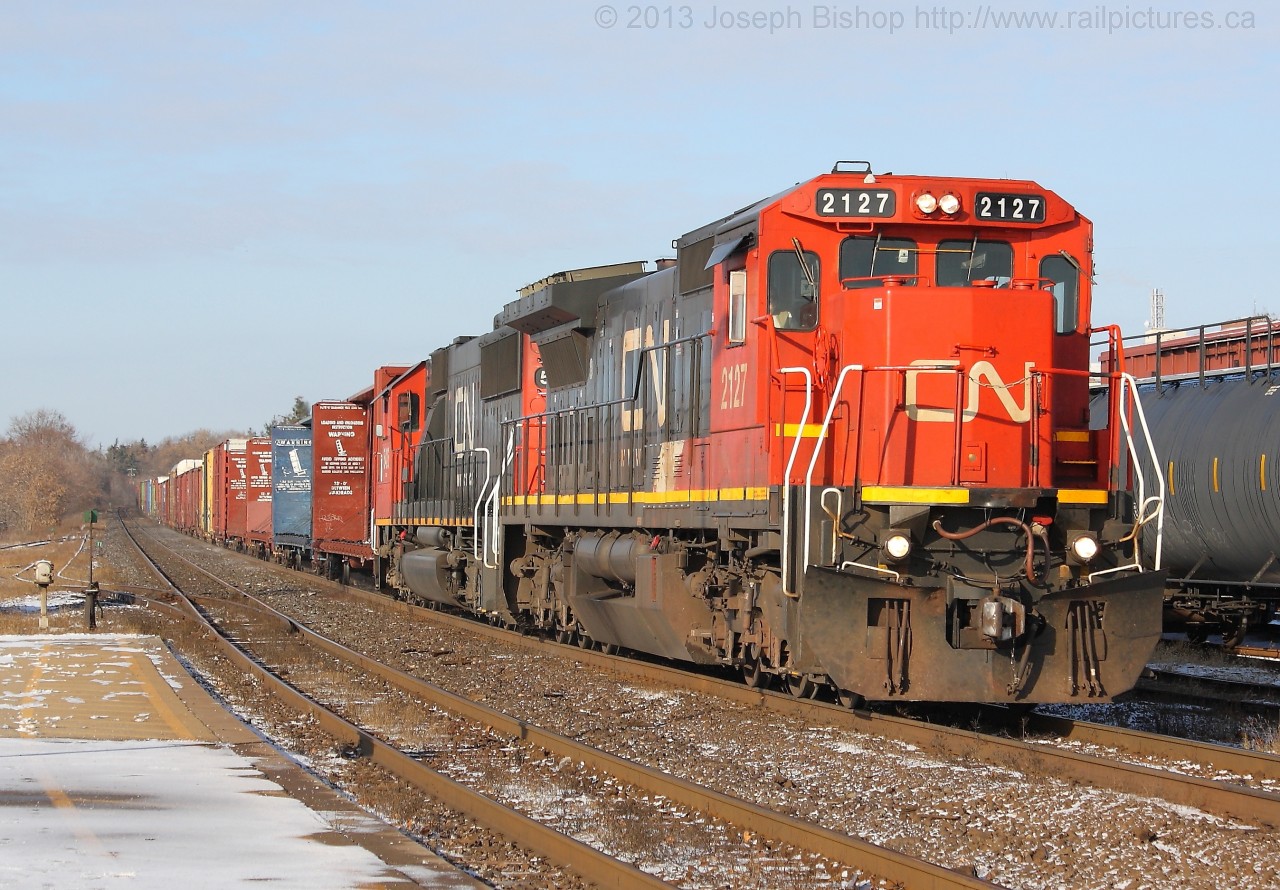 The only sunny day so far this week brought out some good consists on CN this morning.  Here we see CN 332 on the North track at Brantford with CN 2127 leading CN 5426.  It was a great way to start off the weekend that is for sure.