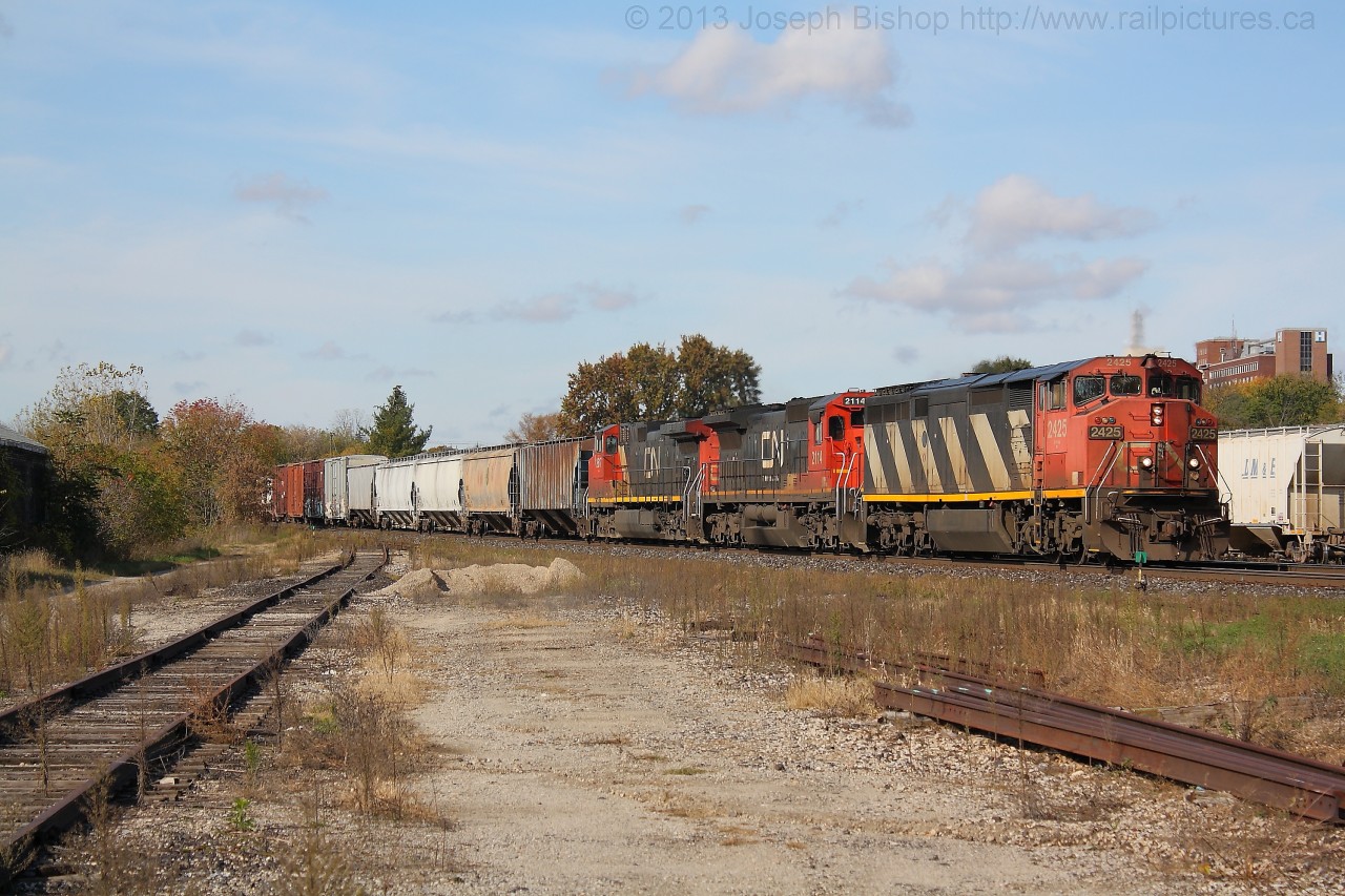 CN 2425 leads 382 through Brantford with the help of two other GE's.