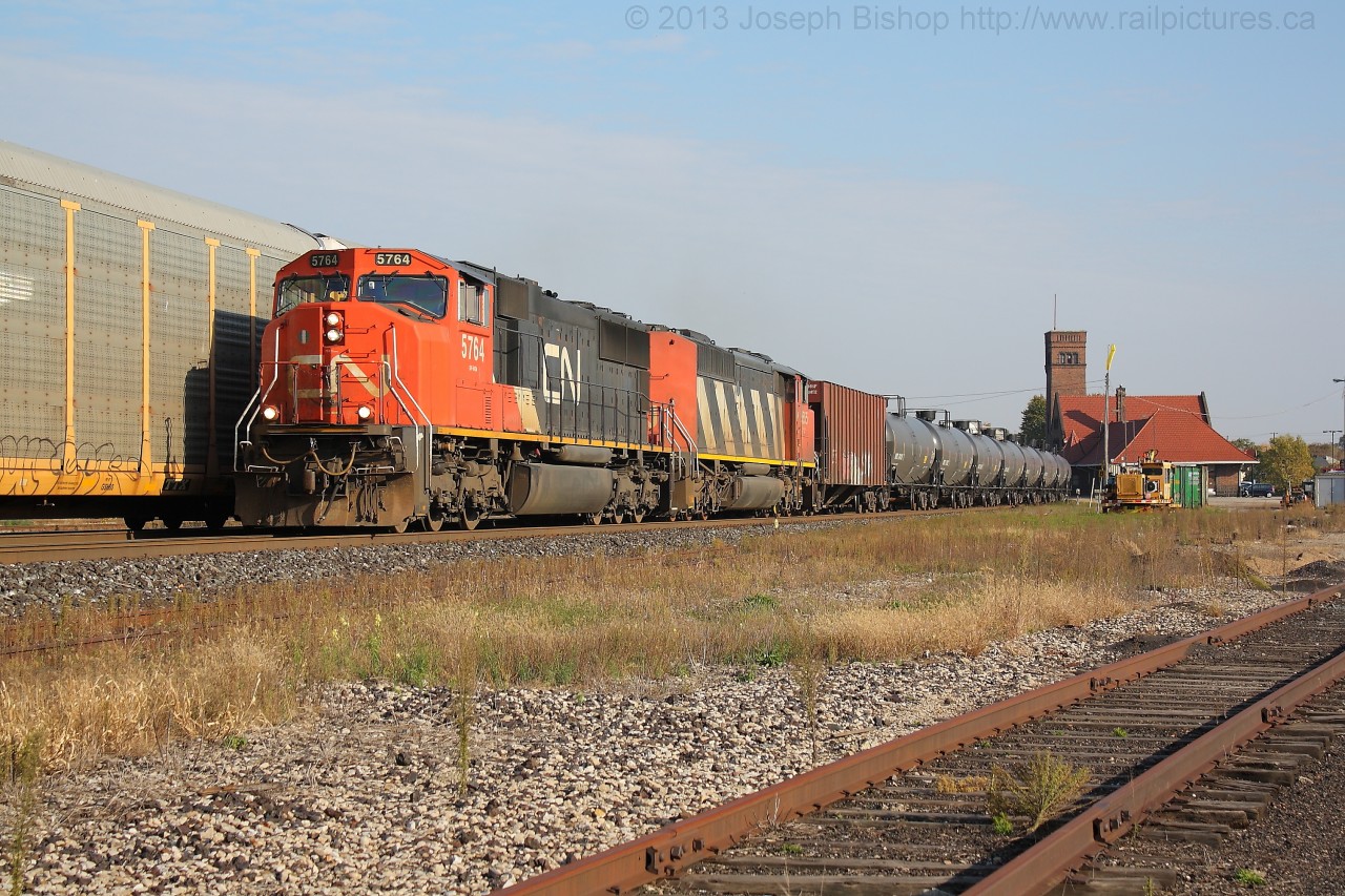 CN 5663 and CN 5555 lead empty crude oil trade U711 through Brantford in the late afternoon.  They are seen over taking CN 435 who is on the North track
