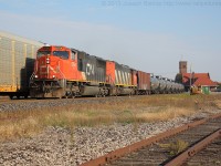 CN 5764 and CN 5555 lead empty crude oil trade U711 through Brantford in the late afternoon.  They are seen over taking CN 435 who is on the North track