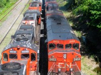 On the right CN 401 with CN 2453, BCOL 4642 & BCOL 4623 head west towards nearby Taschereau Yard, passing a stopped CN 527 with CN 9584, CN 7031, CN 4724 & CN 9524 as power. For more train photos, check out http://www.flickr.com/photos/mtlwestrailfan/ 