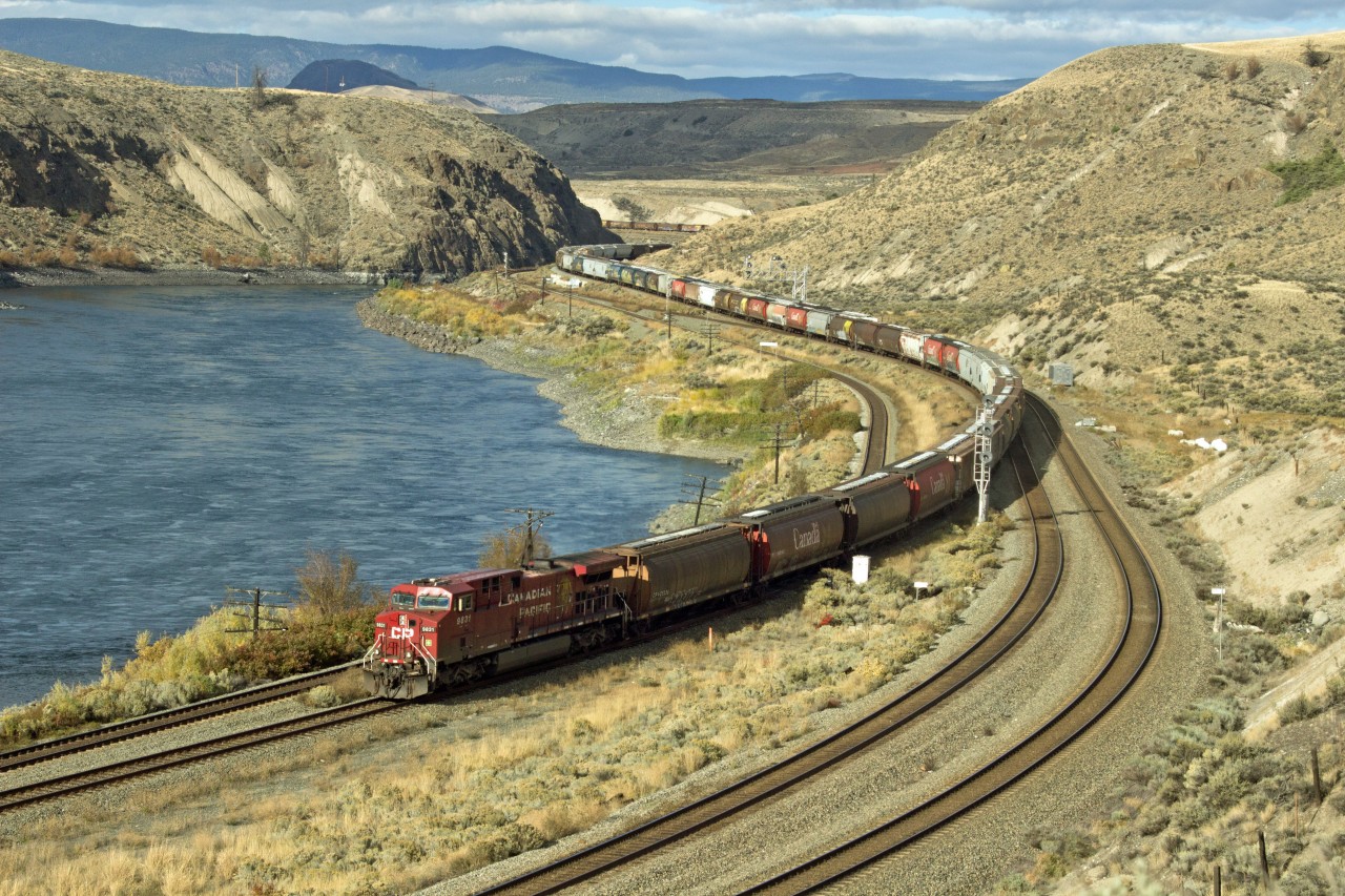 CPR grain train switching from CPR to CNR mainline at Basque on the Thompson River.  All trains run west on CNR and east on CPR between here and Mission B.C.