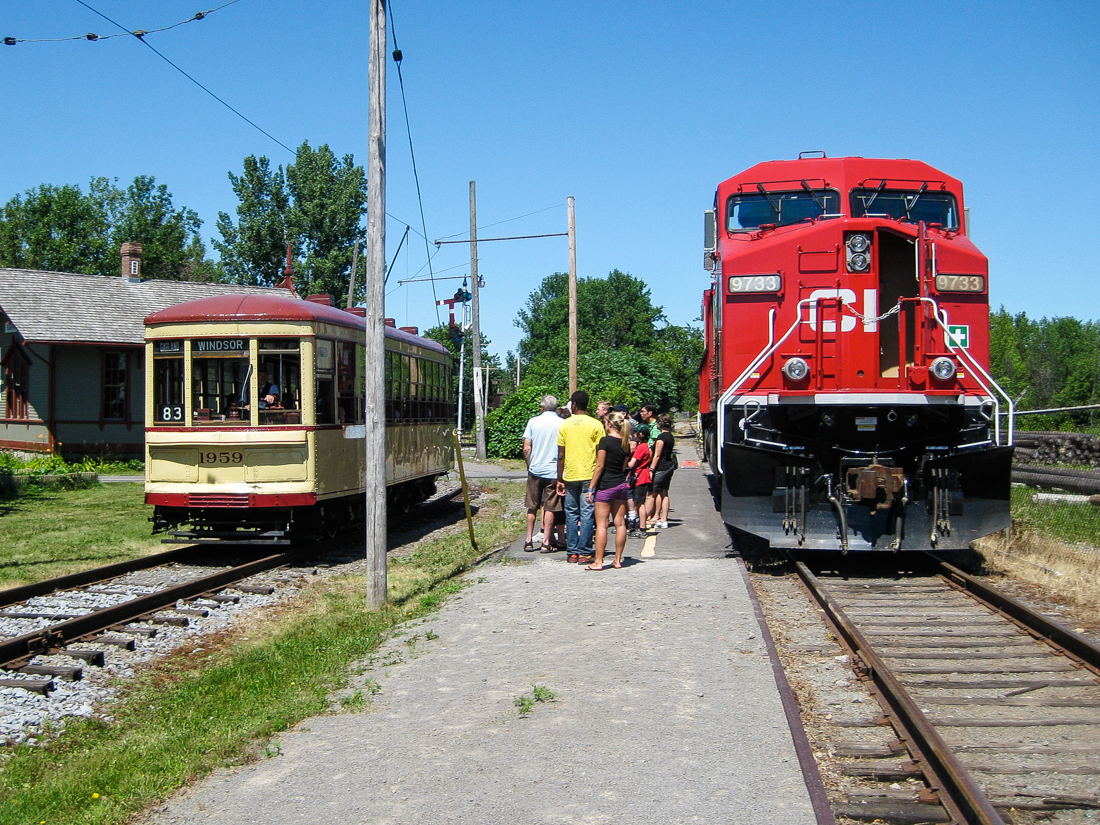 For the 50th anniversary of Exporail in 2011, CP sent a freshly repainted locomotive (CP 9733) to the musuem and opened the cab up to the public. Here people line up for a view of the cab as MTC 1959 passes to the left. Behind is Barrington Station. For more train photos, check out http://www.flickr.com/photos/mtlwestrailfan/