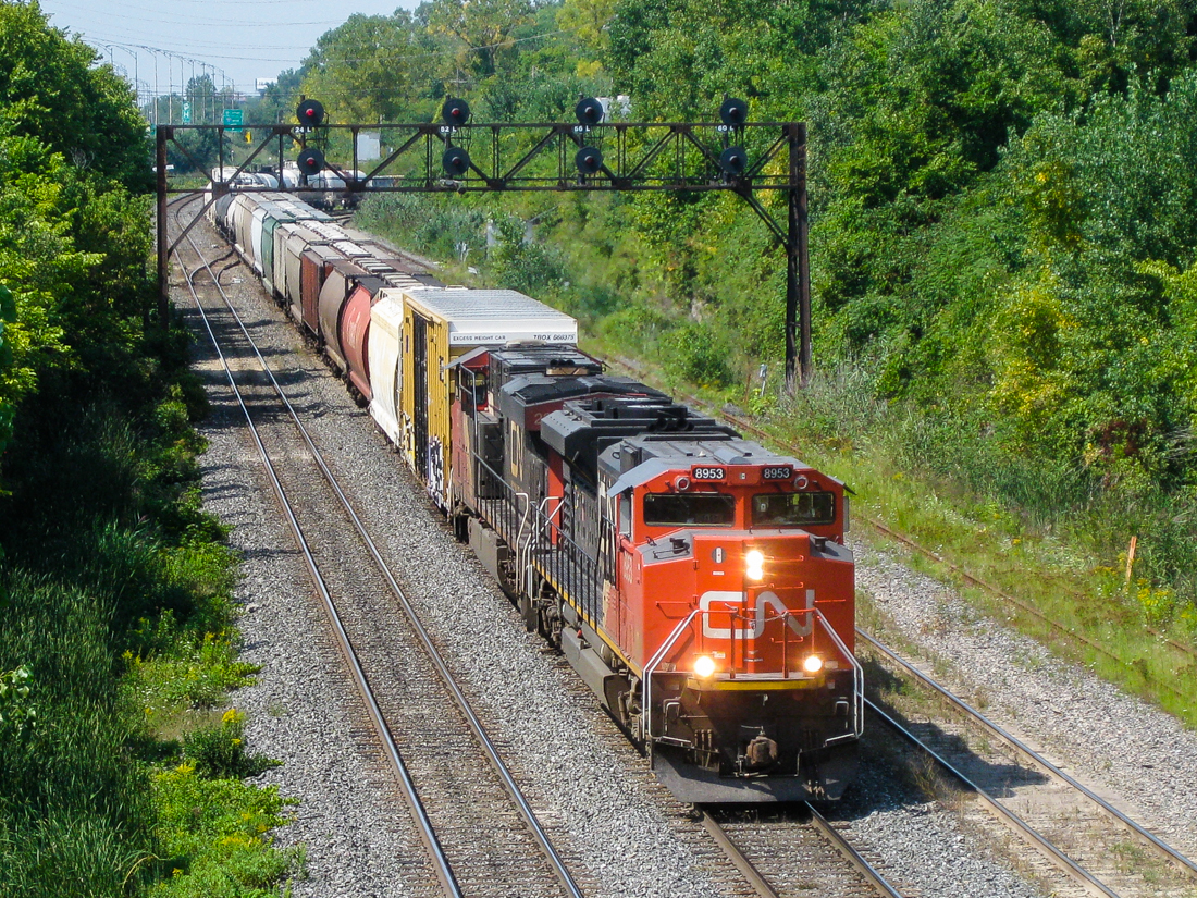 CN 394 is leaving Taschereau Yard and is bound for Richimd, Quebec and interchange with the Saint Lawrence & Atlantic. Power is CN 8953 & CN 2271. For more train photos, check out http://www.flickr.com/photos/mtlwestrailfan/