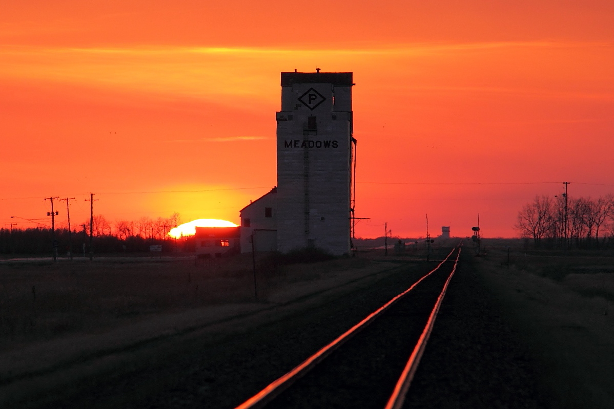Another gorgeous prairie sunset on the two elevators on CP's mainline just outside of Winnipeg. As of Sep 4 2013 the elevator at Marquette was torn down and this one here at Meadows is slated to be torn down sometime in 2014. The old elevators are quickly disappearing throughout the prairies and once there gone photography along the rails just won't be the same.