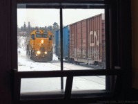 The Northbound Northlander pulls into the station at Huntsville alongside the cars of recently arrived CN 595. A snowy and cold winter's day on the railroad just after Christmas, its nice and warm inside the station. Unknown at the time, this would not be repeatable in less than three years. 1214hrs.