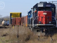 GEXR 432 - with two dimensional loads from Innovative Steam Technologies sits in the high dead weeds of XW Yard in Guelph waiting to depart. GEXR 582 brought the train from Galt the day prior, and on Friday the 15th (Anyone have shots?), CN L421 ran from Mac Yard to Hamilton. These should be going on a ship in Hamilton sometime in the coming days. <br><br> Sharp eyes will notice GEXR 582 switching at left - they are just finishing grabbing the tank car to head south on the Fergus spur.