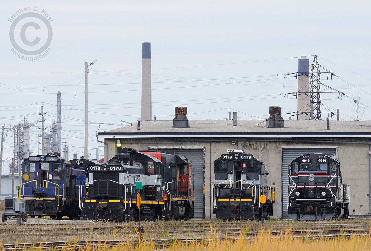 The ex CN Roundhouse is busy again - Lambton Diesel Services of Sarnia has many units shown on the property, many available for lease or works in progress. Including: LDSX 0176 (Former GMD 0069), LDSX 0178 (ex-CN), LDSX 0179 (ex-SOR/CN), CCGX 4016 (ex-CN), LDSX 1251 (ex-Lasco Steel, exx-CN), CN 750X (Work in progress). Inside the shops is GEXR 3030 (ex-RMPX/CN 9431, a GP40-2W - Paint and repairs) and CSXT 2757 (Sideswipe repairs).